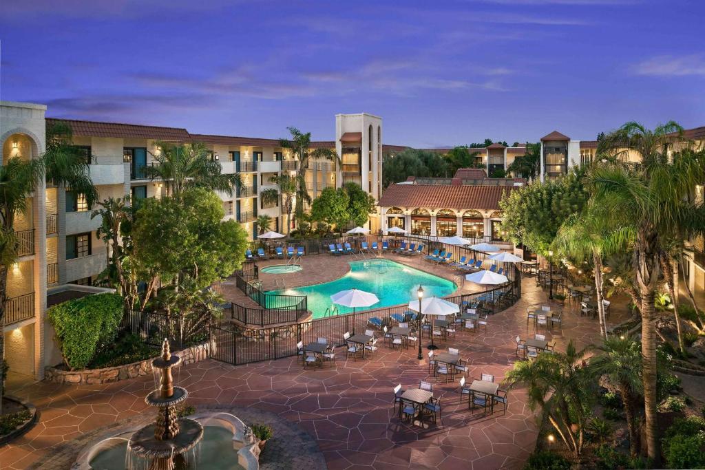 an aerial view of a hotel with a swimming pool at Embassy Suites by Hilton Scottsdale Resort in Scottsdale