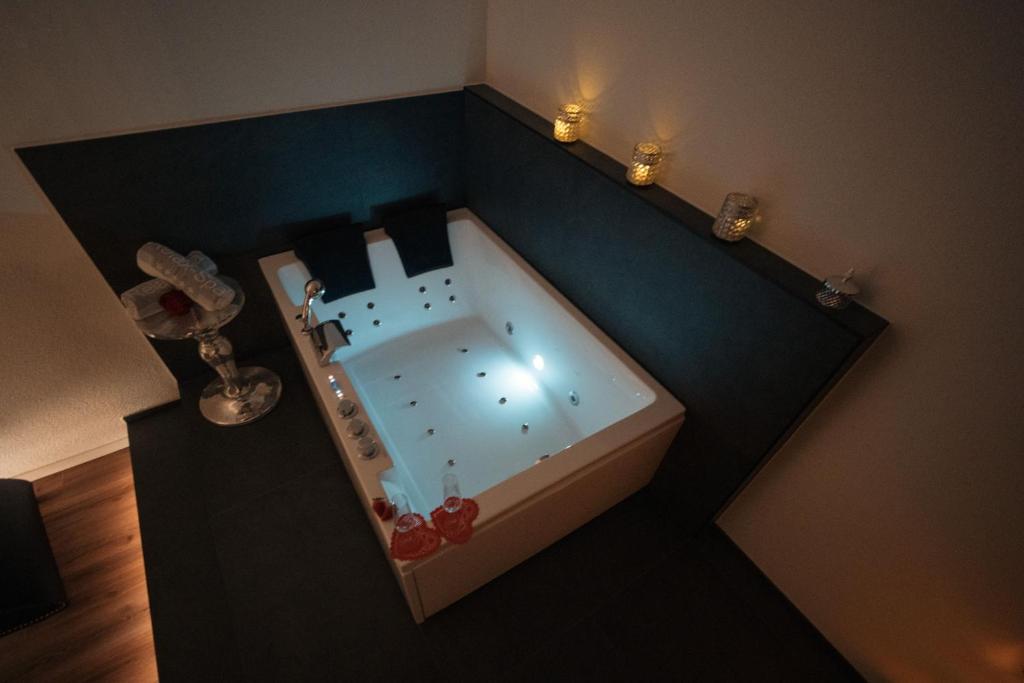 an overhead view of a bath tub in a room at Privat-Spa mit Whirlpool und Sauna in Sursee in Sursee