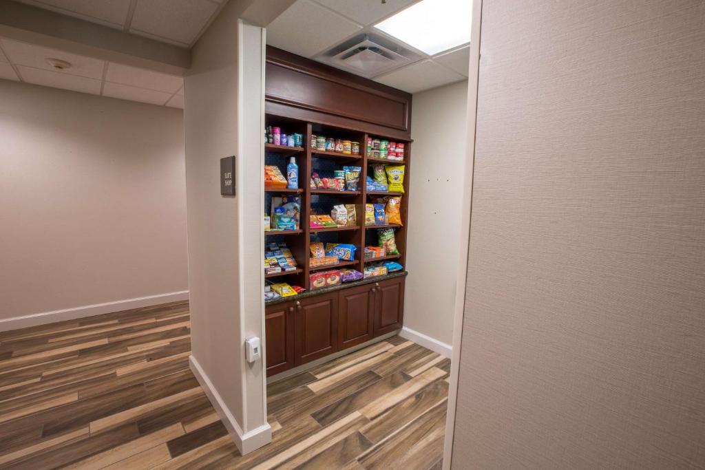 a hallway with a pantry with food in it at Hampton Inn & Suites Berkshires-Lenox in Lenox