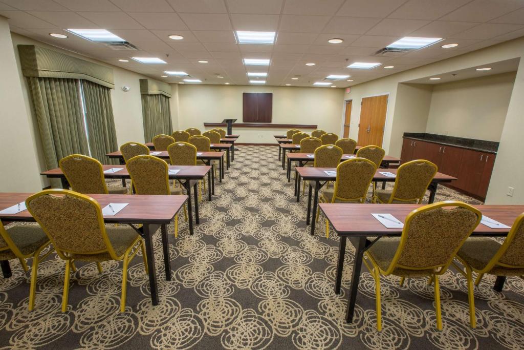 a conference room with tables and chairs and a podium at Hampton Inn & Suites Berkshires-Lenox in Lenox