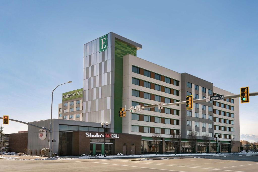 a rendering of a large building at an intersection at Embassy Suites by Hilton Salt Lake West Valley City in West Valley City