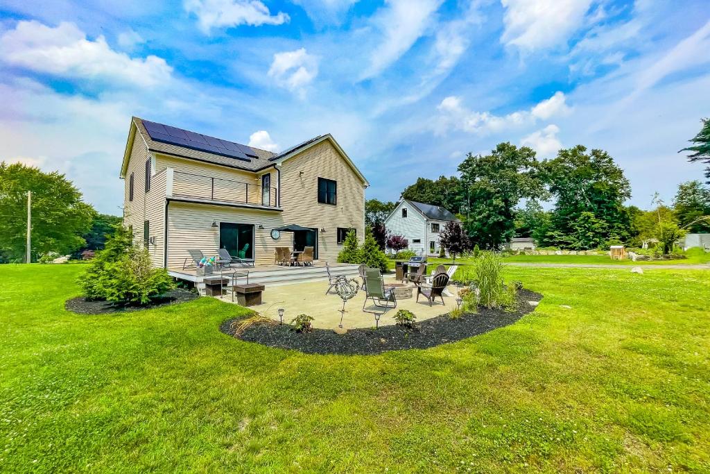 a house with a large yard with a patio at Salisbury Sanctuary in Salisbury