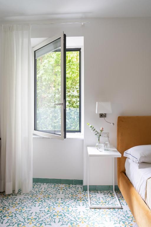 Postel nebo postele na pokoji v ubytování Residenza Amalphia