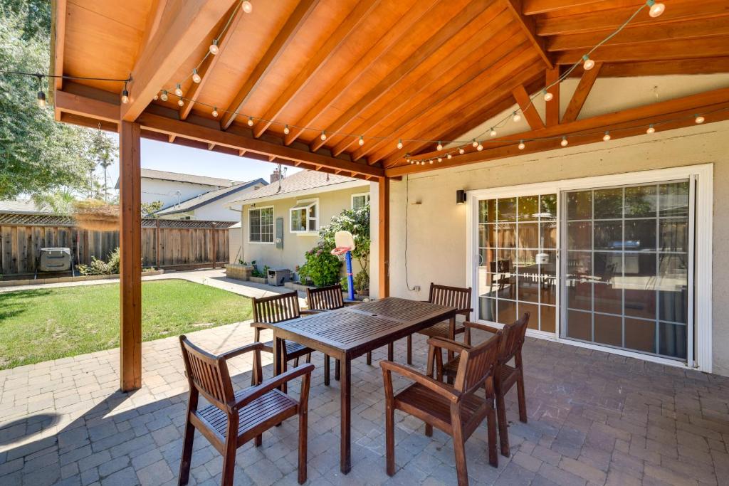 a patio with a wooden pergola and a table and chairs at Campbell Vacation Rental about 8 Mi to San Jose! in Campbell