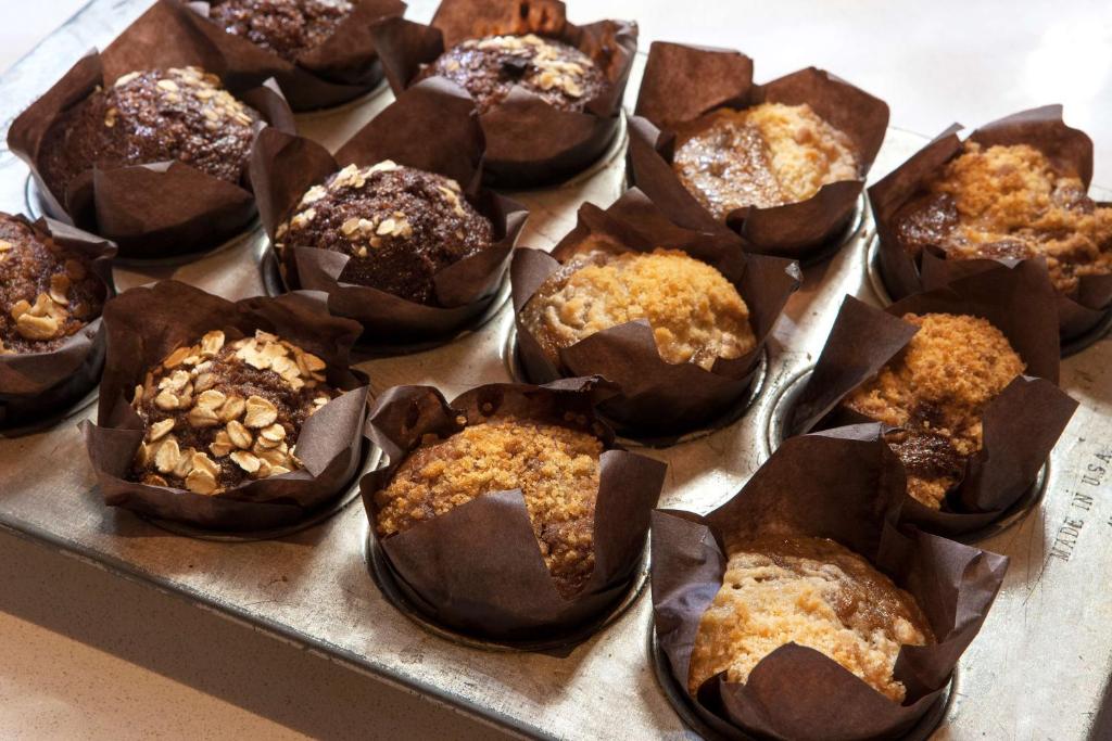 a muffin tin filled with chocolate muffins on a table at DoubleTree by Hilton Johnson City in Johnson City