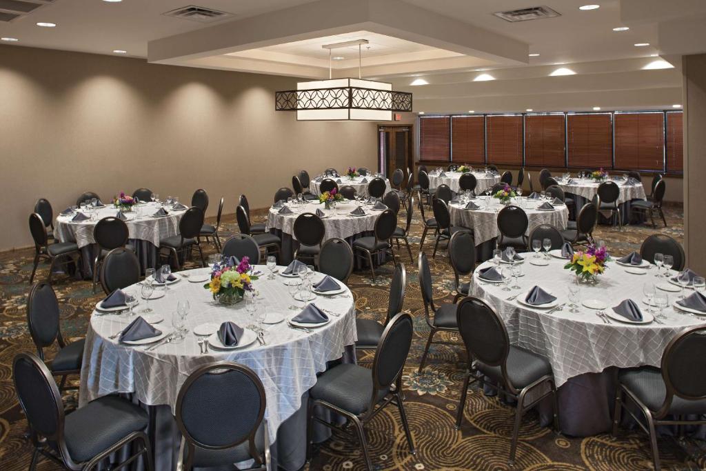a banquet hall with round tables and chairs at DoubleTree by Hilton Johnson City in Johnson City