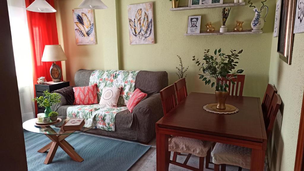 a living room with a couch and a table at ApartamentoLillos in Luanco