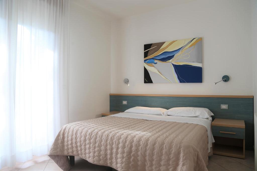 Кровать или кровати в номере Villaggio Mare Blu