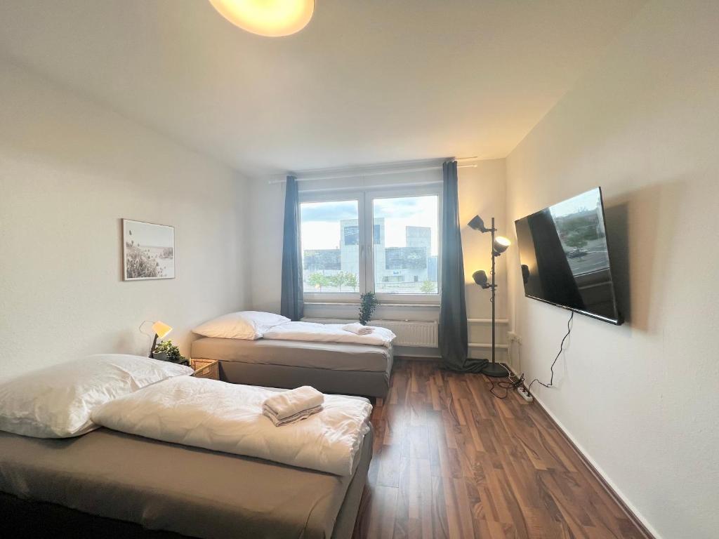 Postel nebo postele na pokoji v ubytování Zentrale Apartments im Herzen vom Bremerhaven