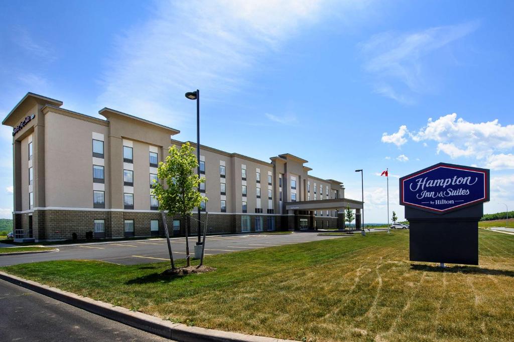 a large building with a sign in front of it at Hampton Inn & Suites Truro, NS in Truro