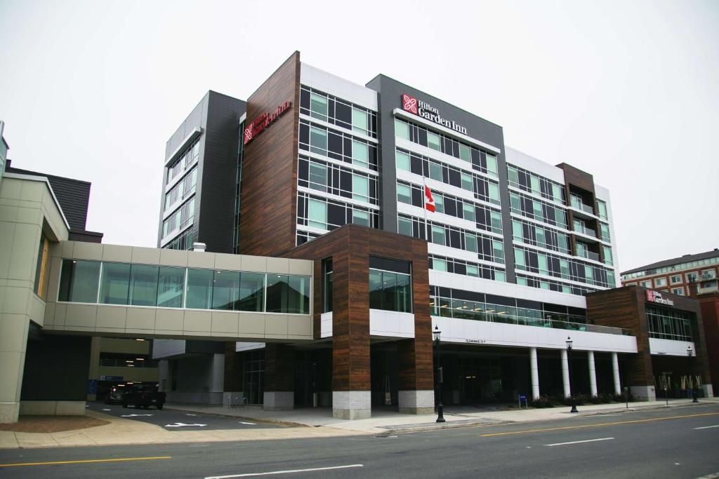 a large building on a street in a city at Hilton Garden Inn Fredericton in Fredericton