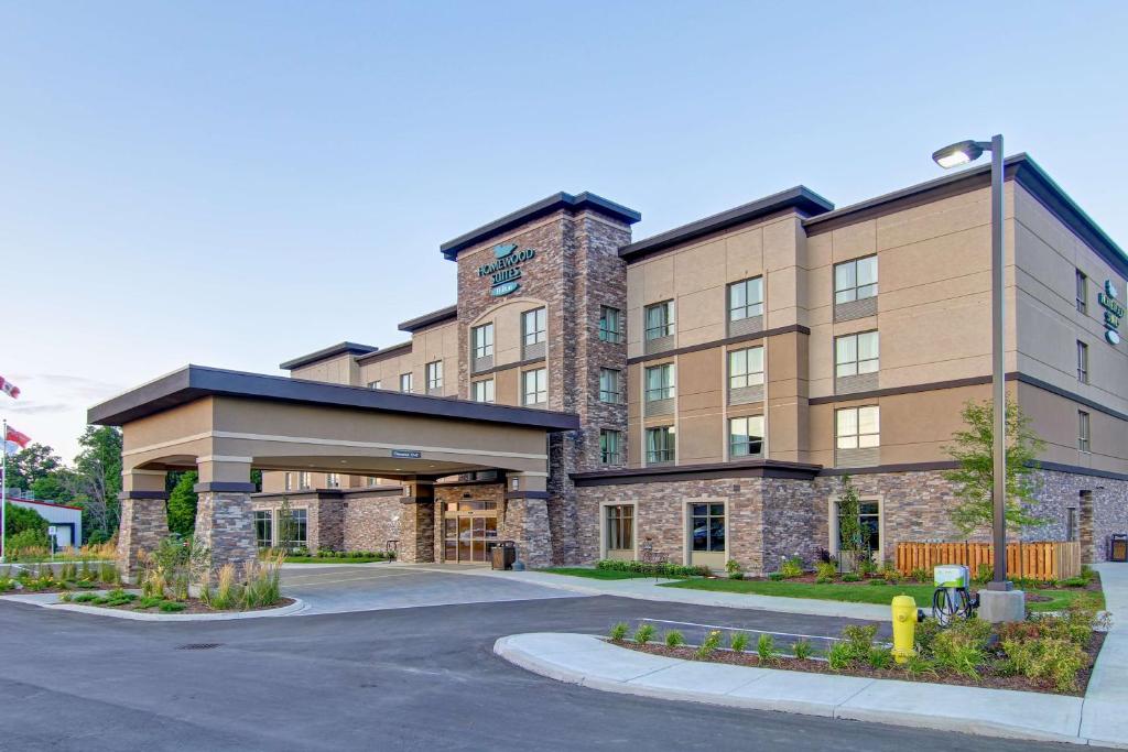 a building with a parking lot in front of it at Homewood Suites by Hilton Waterloo/St. Jacobs in Waterloo