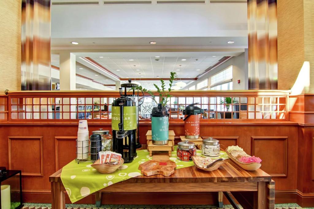 a table with bottles of wine on top of it at Hilton Garden Inn Ottawa Airport in Ottawa
