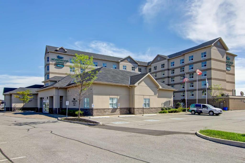 a building with a car parked in front of it at Homewood Suites by Hilton Toronto-Markham in Markham