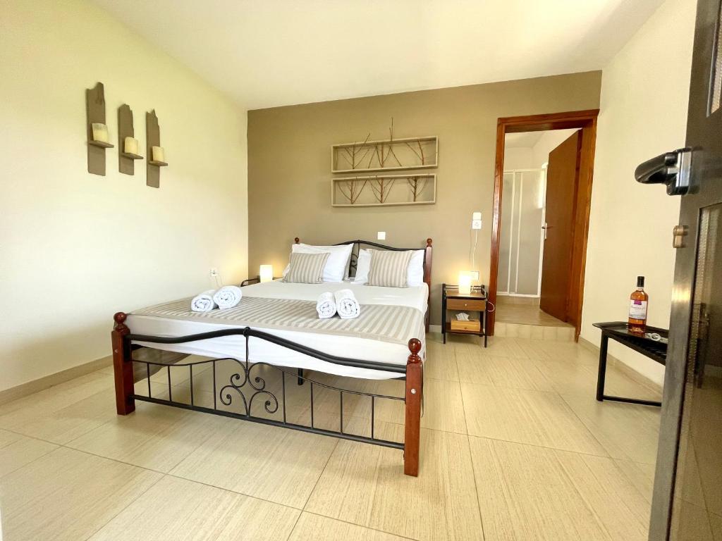 Postel nebo postele na pokoji v ubytování Jo Marinis Rooms