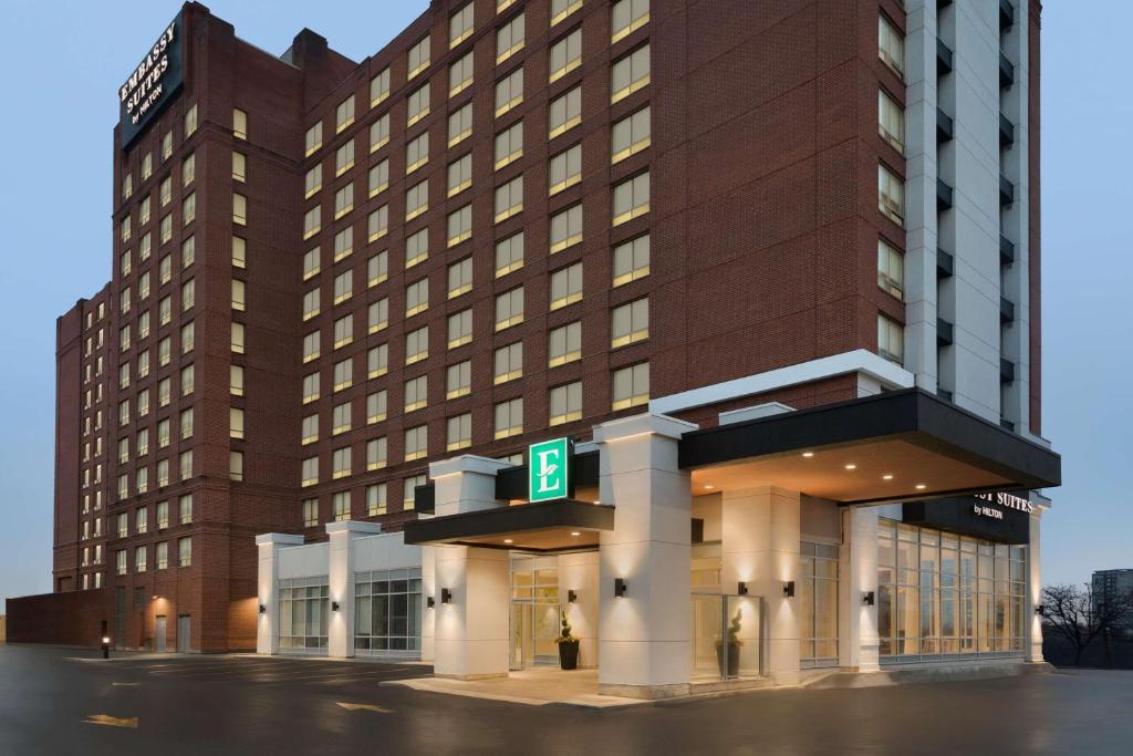 a building with a parking lot in front of it at Embassy Suites By Hilton Toronto Airport in Toronto