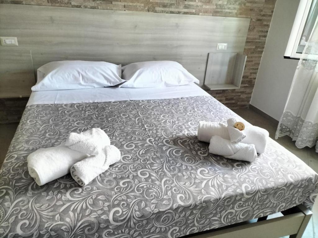 Postel nebo postele na pokoji v ubytování Hera Tropea Rooms