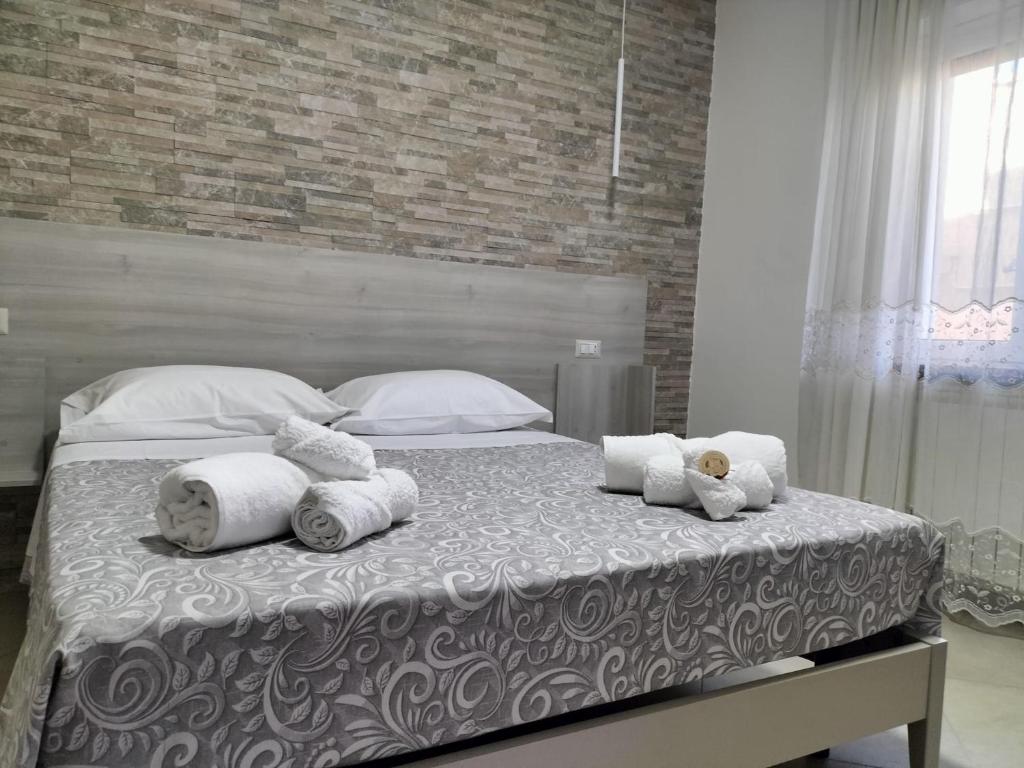 Postel nebo postele na pokoji v ubytování Hera Tropea Rooms
