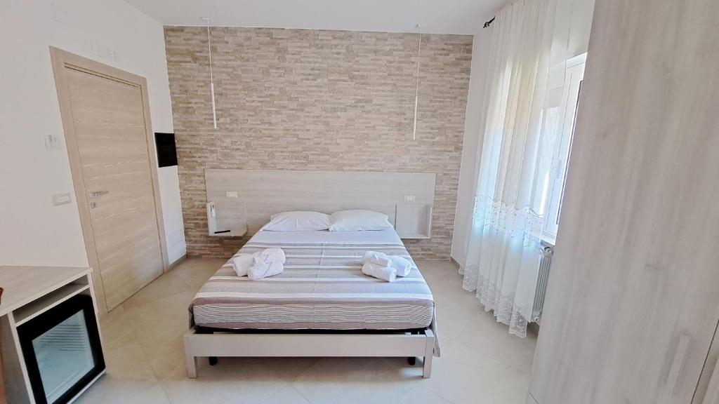 Postel nebo postele na pokoji v ubytování Hera Tropea Rooms