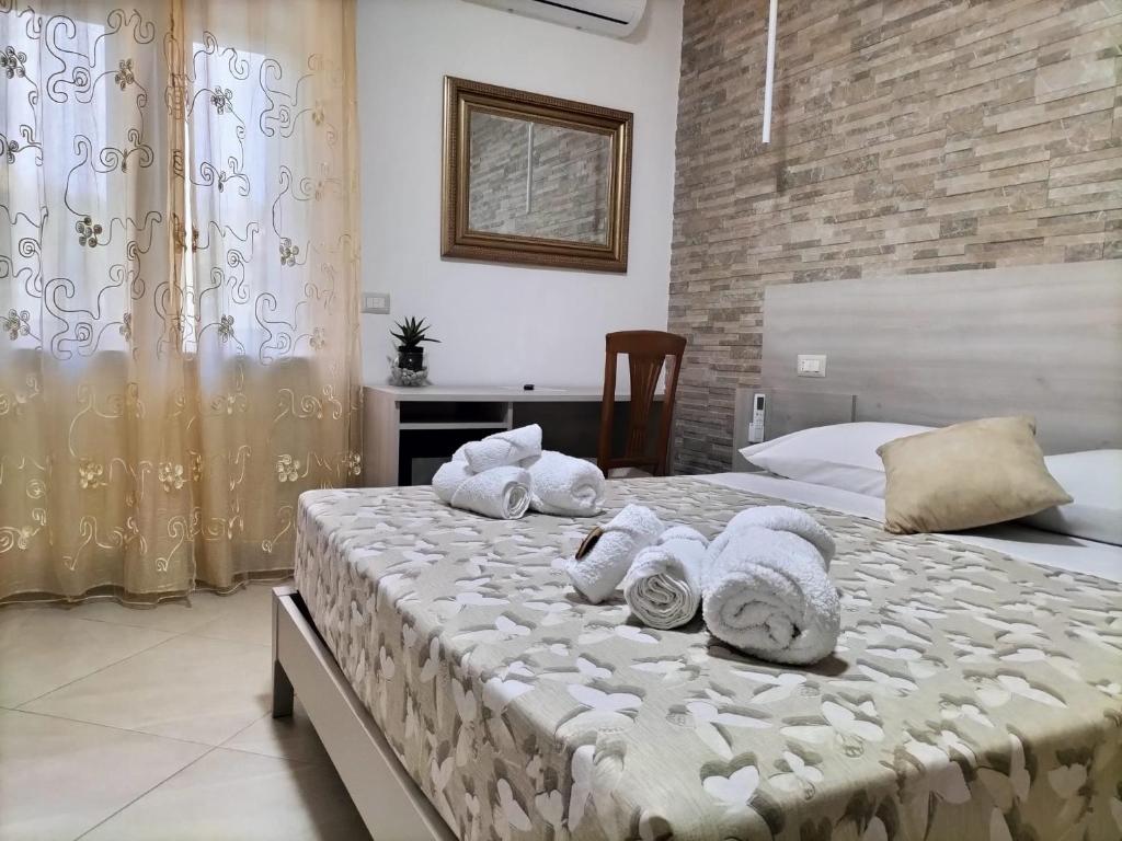 Postel nebo postele na pokoji v ubytování Hera Tropea Rooms