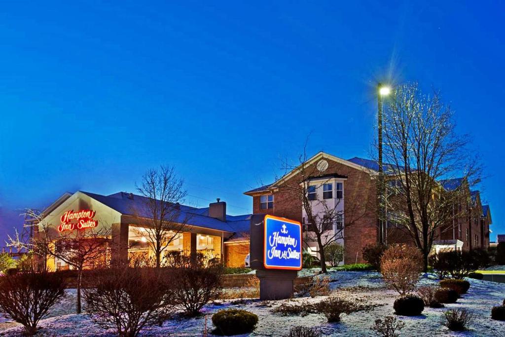 a sign in front of a building in the snow at Hampton Inn & Suites Cleveland-Independence in Independence