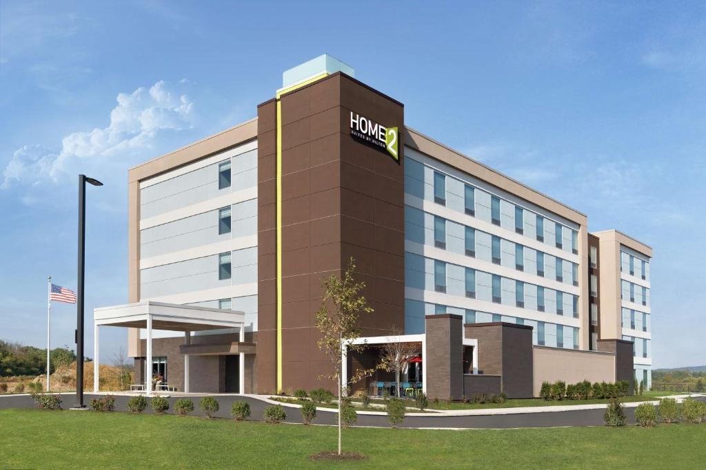 a hotel building with a hilton sign on it at Home2 Suites By Hilton Harrisburg in Harrisburg