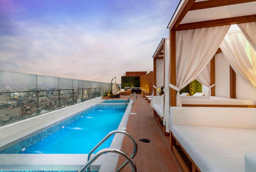 a pool on the roof of a building at Departamento de Estreno en Barranco in Lima