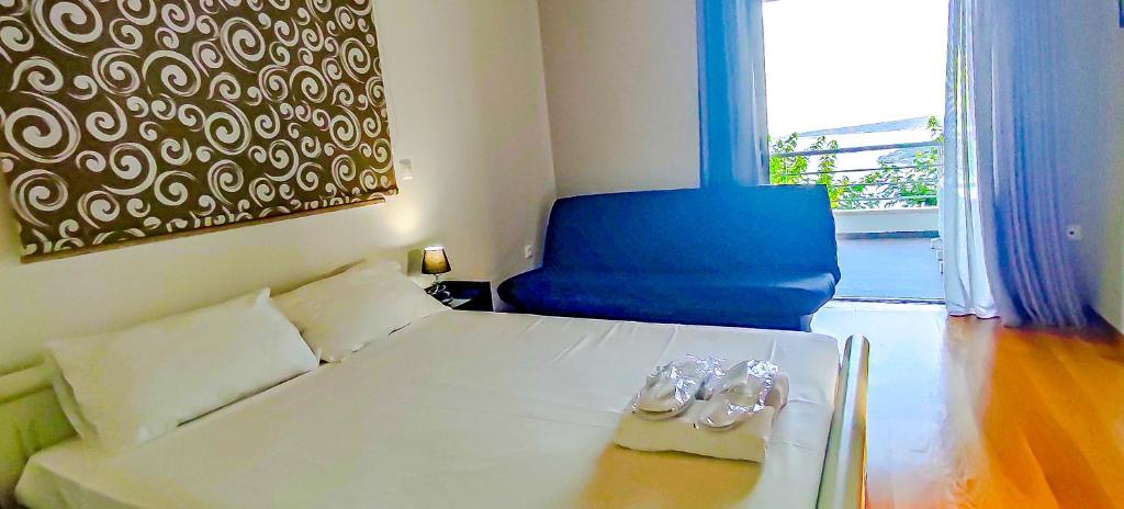 Кровать или кровати в номере Avatonblue Villa Nafplio