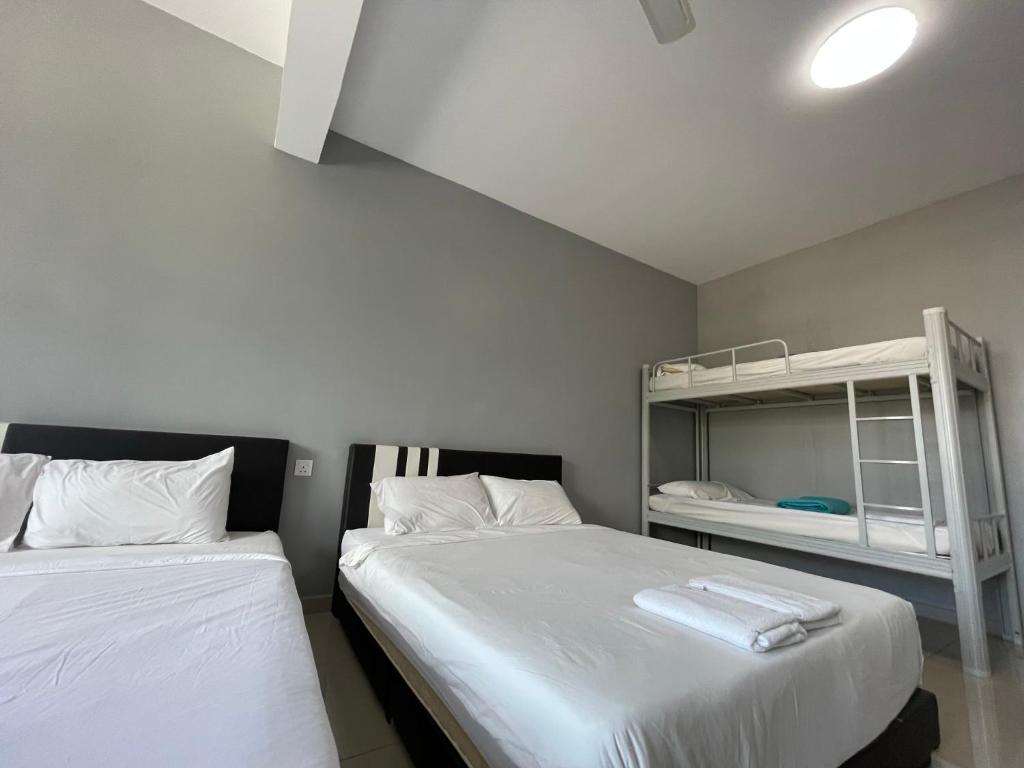 Postel nebo postele na pokoji v ubytování Reno Hotel Ipoh