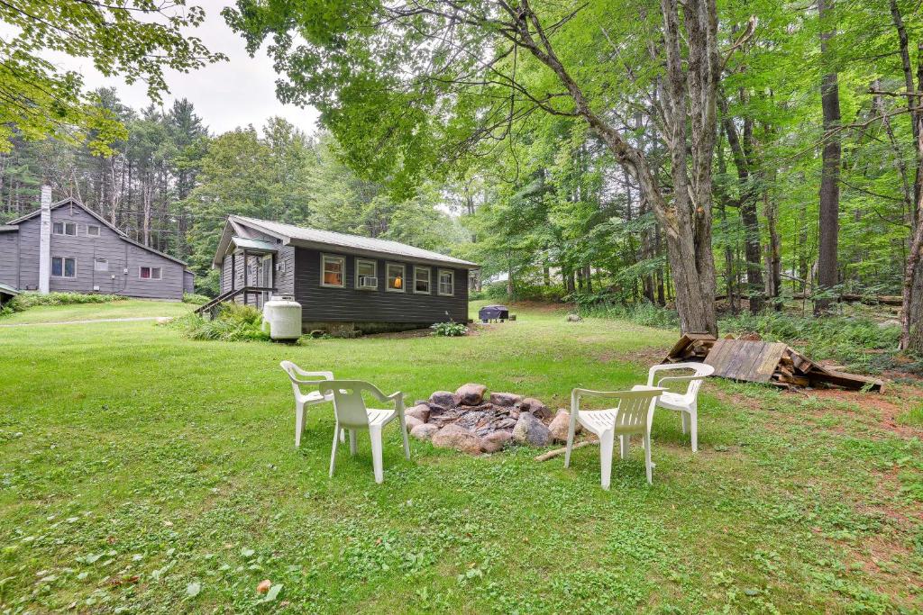 a group of chairs sitting around a fire in a yard at Brantingham Cottage with Fire Pit and Forested Views! in Glenfield