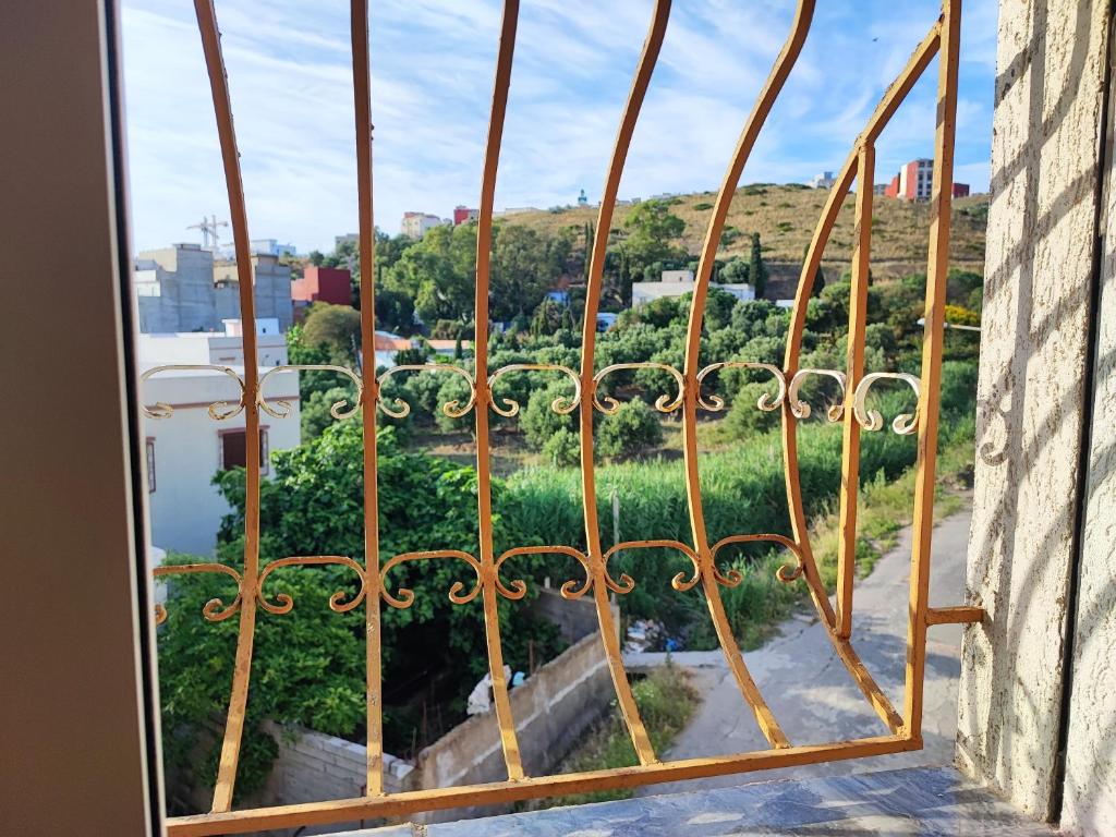 a view from a window of a garden at Appartement Meublé Avec 3 Façades Dans Une Zone Calme in Tangier