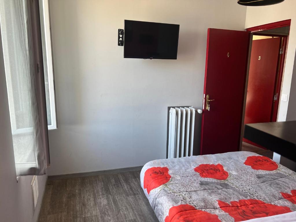 Postel nebo postele na pokoji v ubytování Hôtel des 2 Gares
