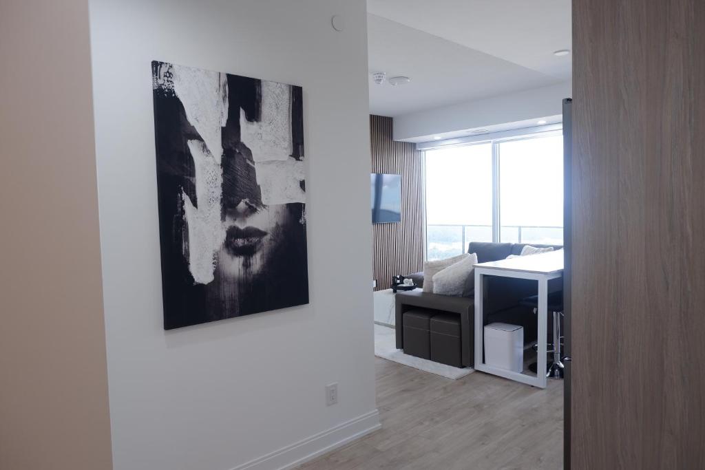 an office with a painting on the wall and a desk at Modern luxury Waterfront Condo in Mississauga