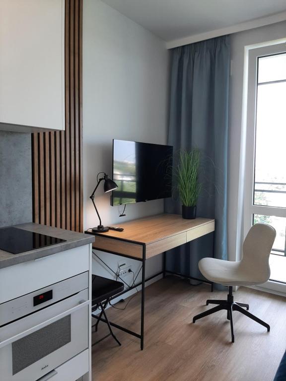 Μια τηλεόραση ή/και κέντρο ψυχαγωγίας στο Cubus Nest Apartment