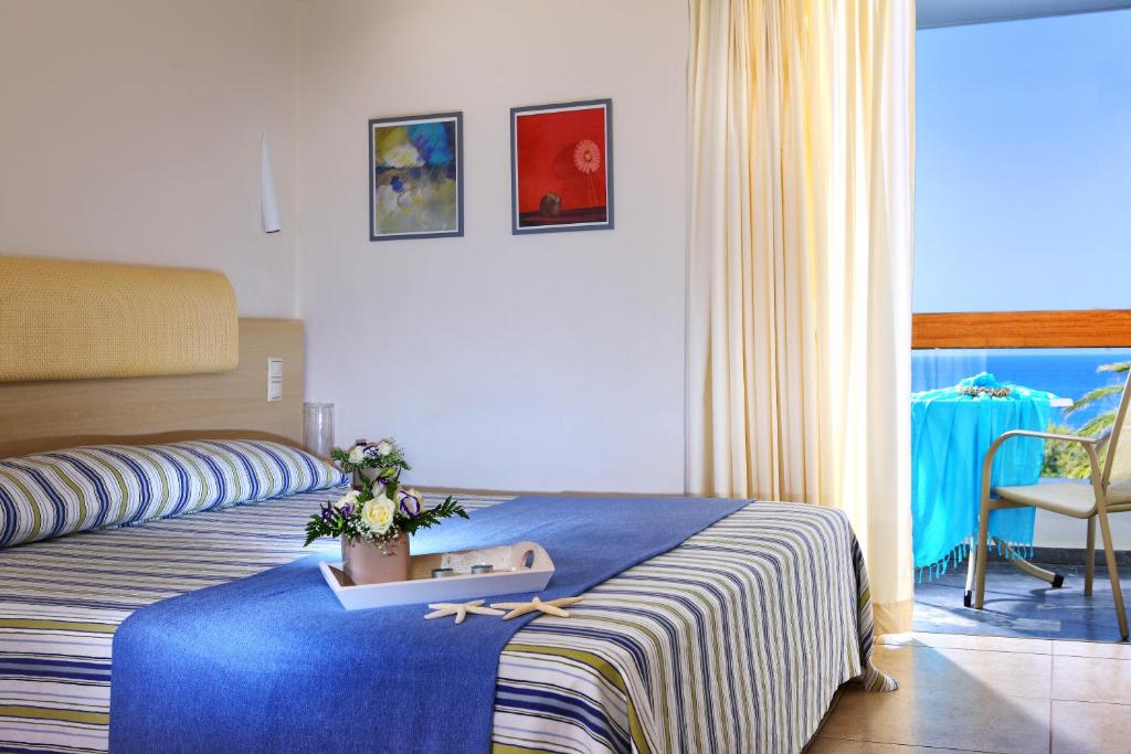 Postel nebo postele na pokoji v ubytování Sitia Beach City Resort & Spa