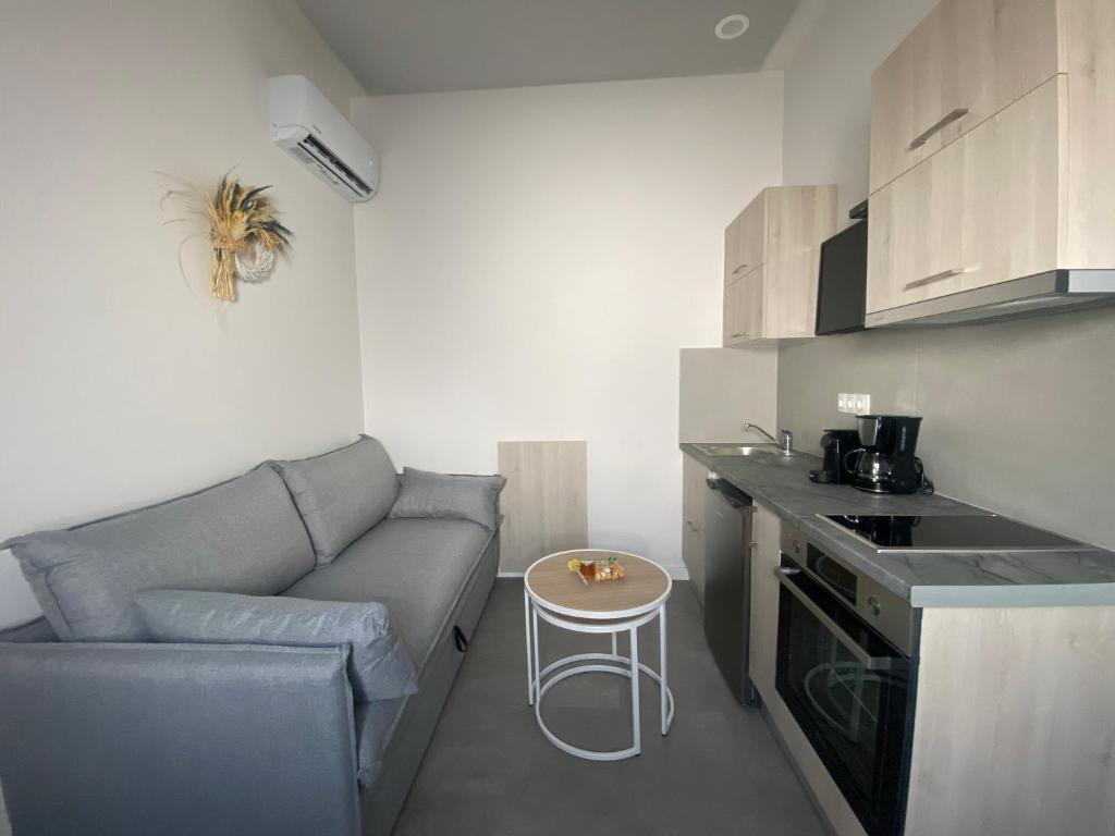 a kitchen with a couch and a table in a room at Serendipity Living in Kythira