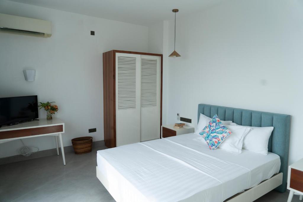 Postel nebo postele na pokoji v ubytování Four Petals Inn