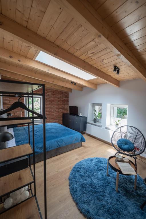 a bedroom with a bunk bed and a loft at Apartamenty Młyńska 5 in Bielsko-Biała