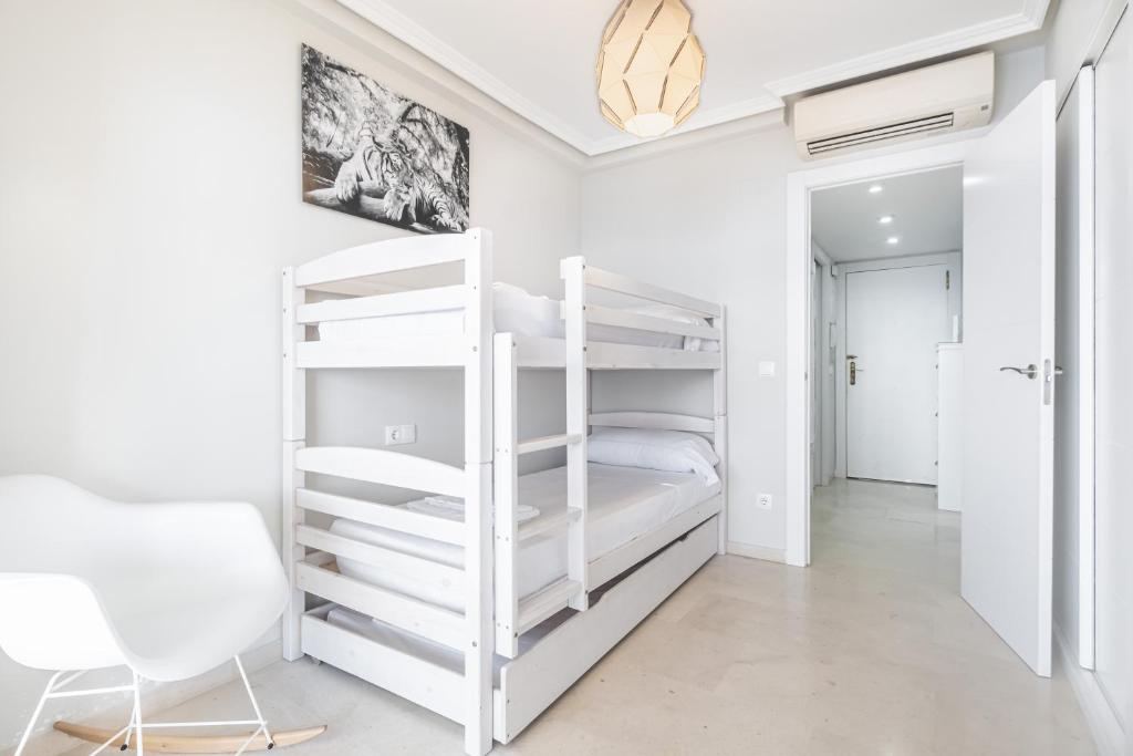 A bed or beds in a room at Los Gemelos 21-B Apartment Levante Beach
