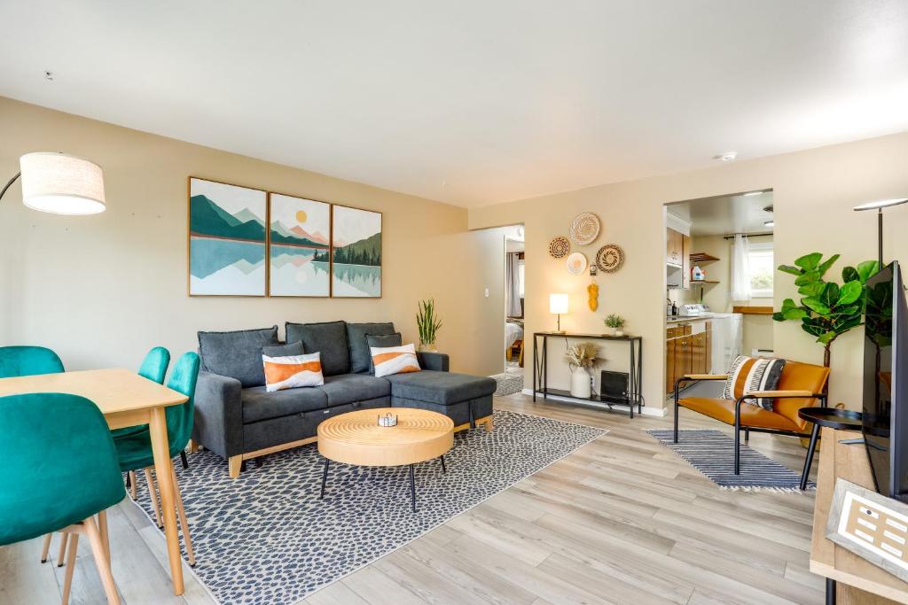 a living room with a couch and a table at Scandi Boho Seattle Apartment with a King-Sized Bed in Seattle