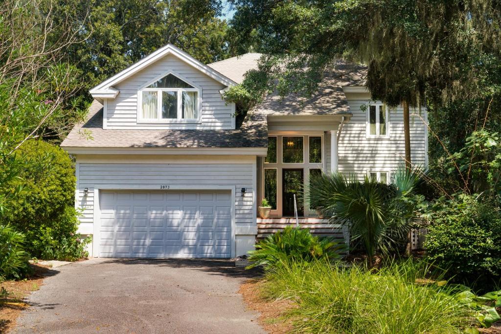 a white house with a garage at 2873 Hidden Oak Drive in Seabrook Island