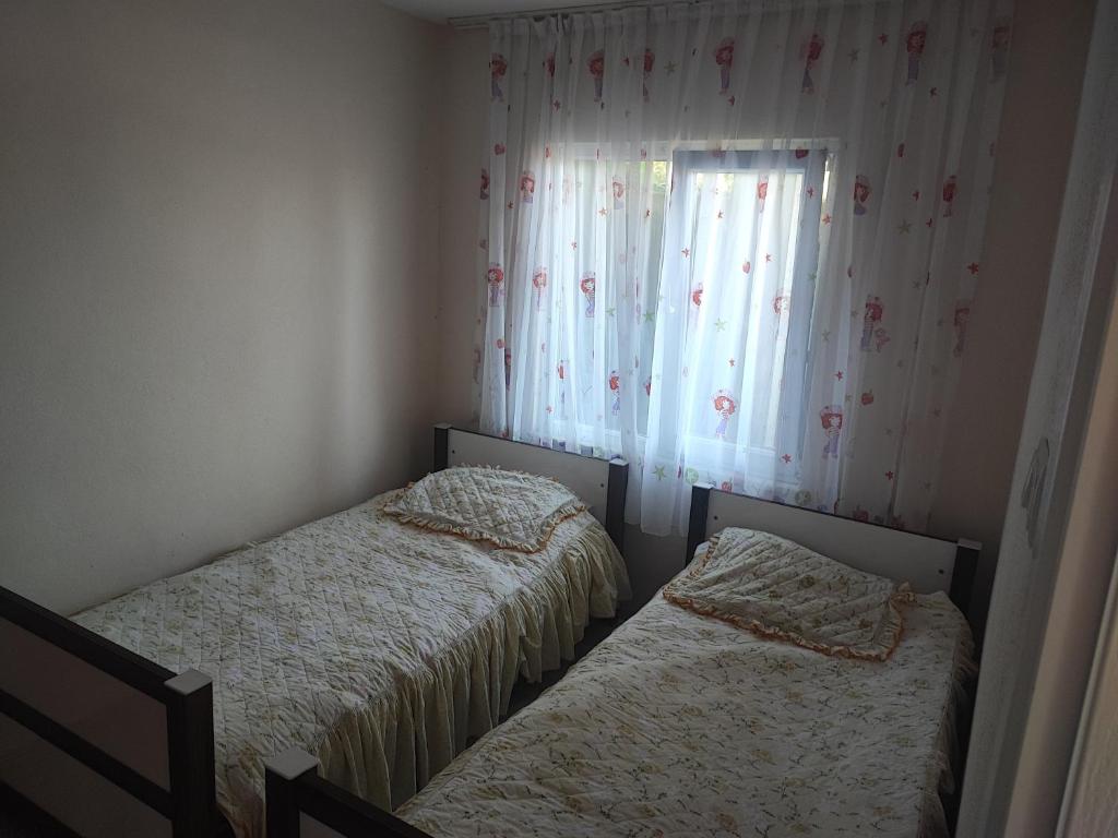 Un pat sau paturi într-o cameră la Hamsiköy Merkez Daire