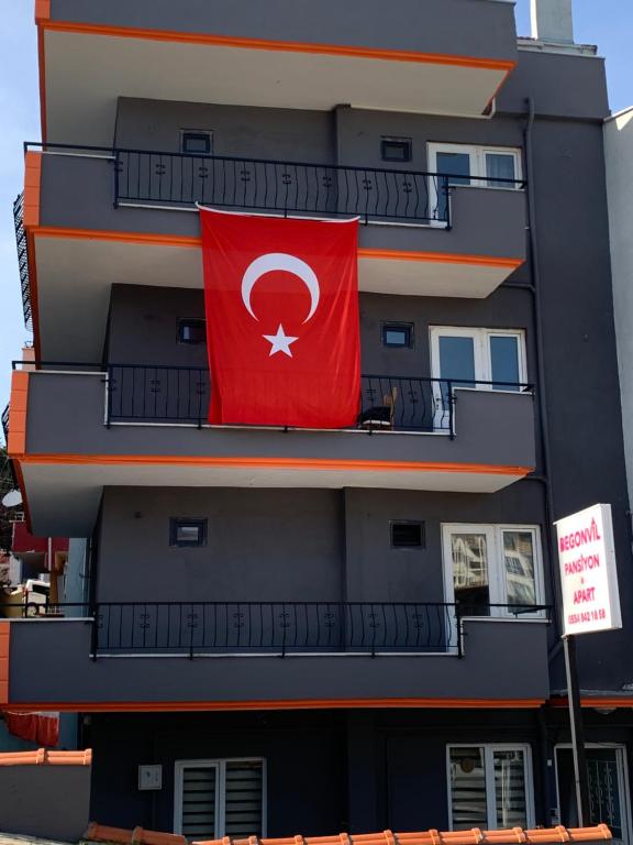 a red flag on the side of a building at Begonvil Pansiyon in Çanakkale