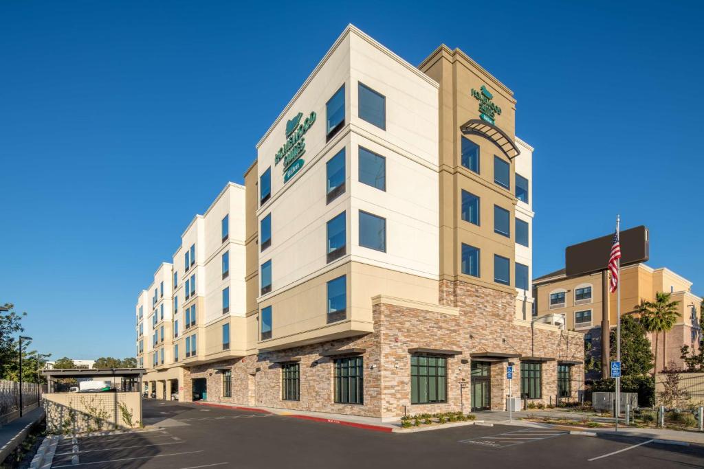 a rendering of the front of the hotel at Homewood Suites By Hilton Belmont in Belmont