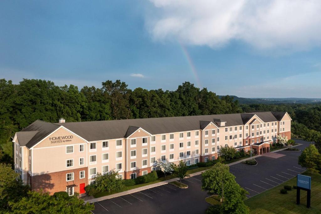 an aerial view of a hotel building with a parking lot at Homewood Suites by Hilton Wallingford-Meriden in Wallingford