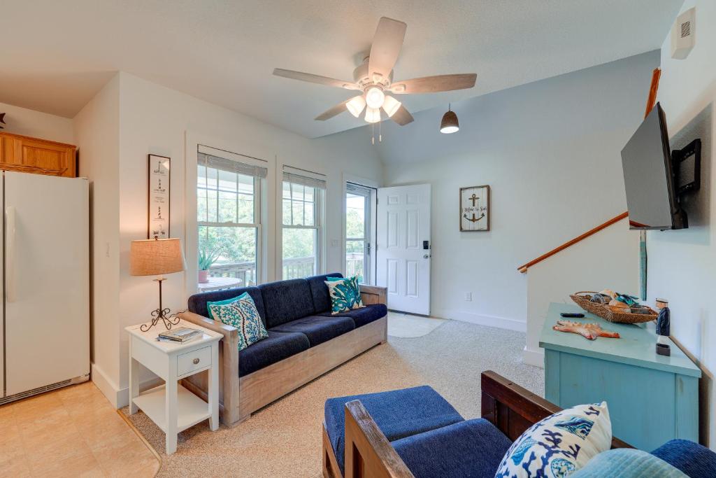 a living room with a couch and a tv at Near Ocean Buxton Townhome with Patio! in Buxton