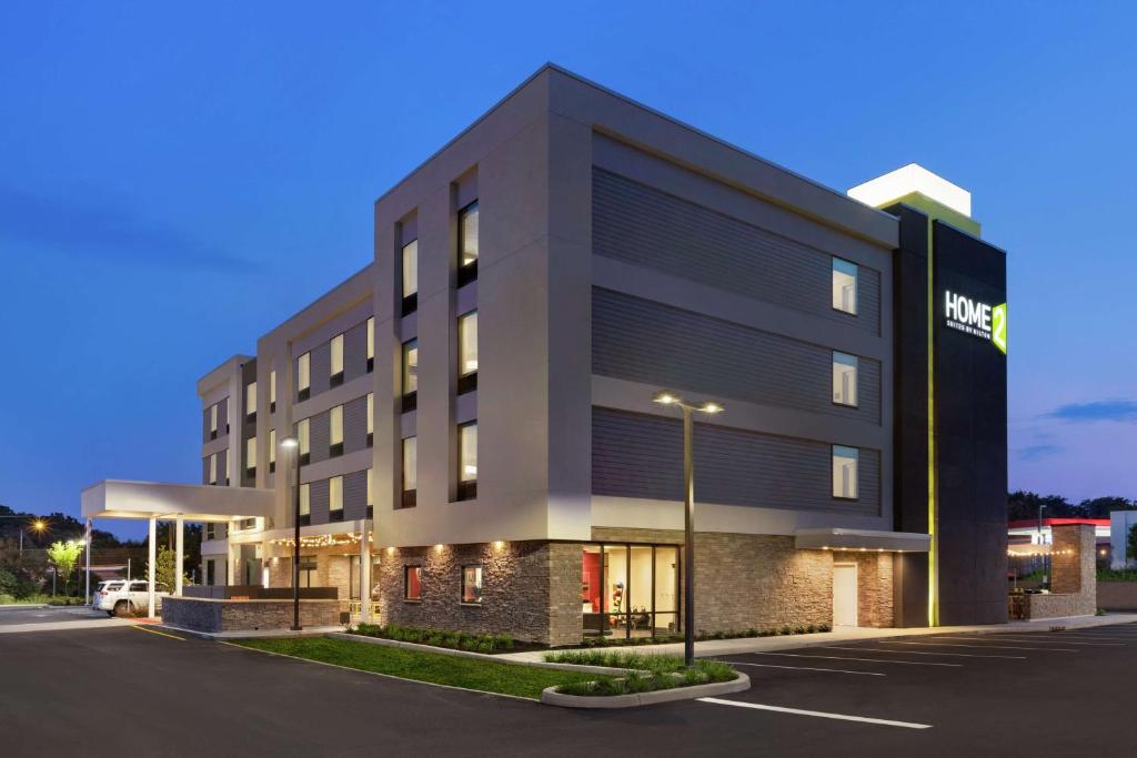 a building with a hotel on the side of a street at Home2 Suites by Hilton New Brunswick, NJ in New Brunswick