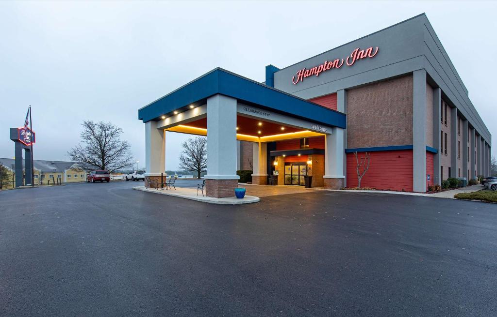 a store with a parking lot in front of it at Hampton Inn Corbin in Corbin