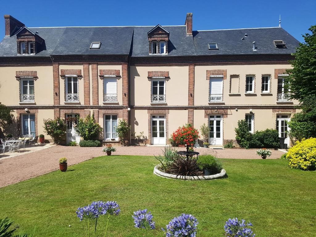 a large house with a garden in front of it at Le Clos Saint-Germain in Rugles
