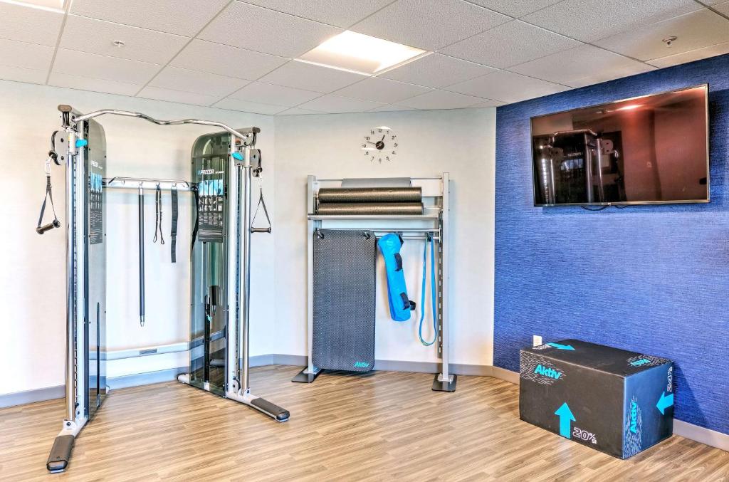 a room with a gym with a door and a box at Hampton by Hilton Ottawa in Ottawa